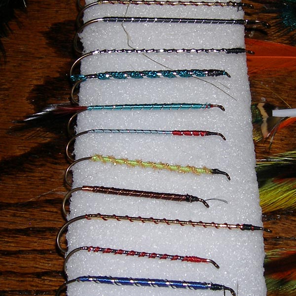 Pre-dressed hooks waiting for a wing to complete it. Pre-dressed hooks waiting for a wing to complete it.